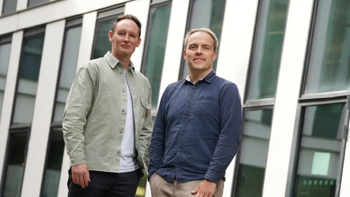 Nooku founders standing infant of a building 