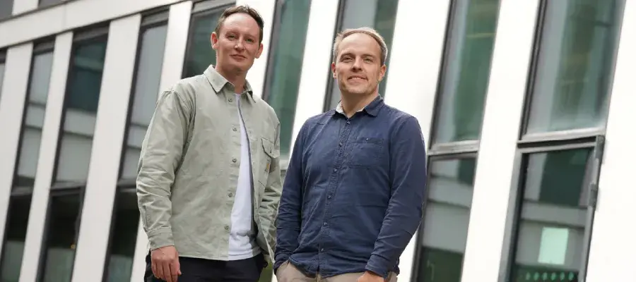Nooku founders standing infant of a building 