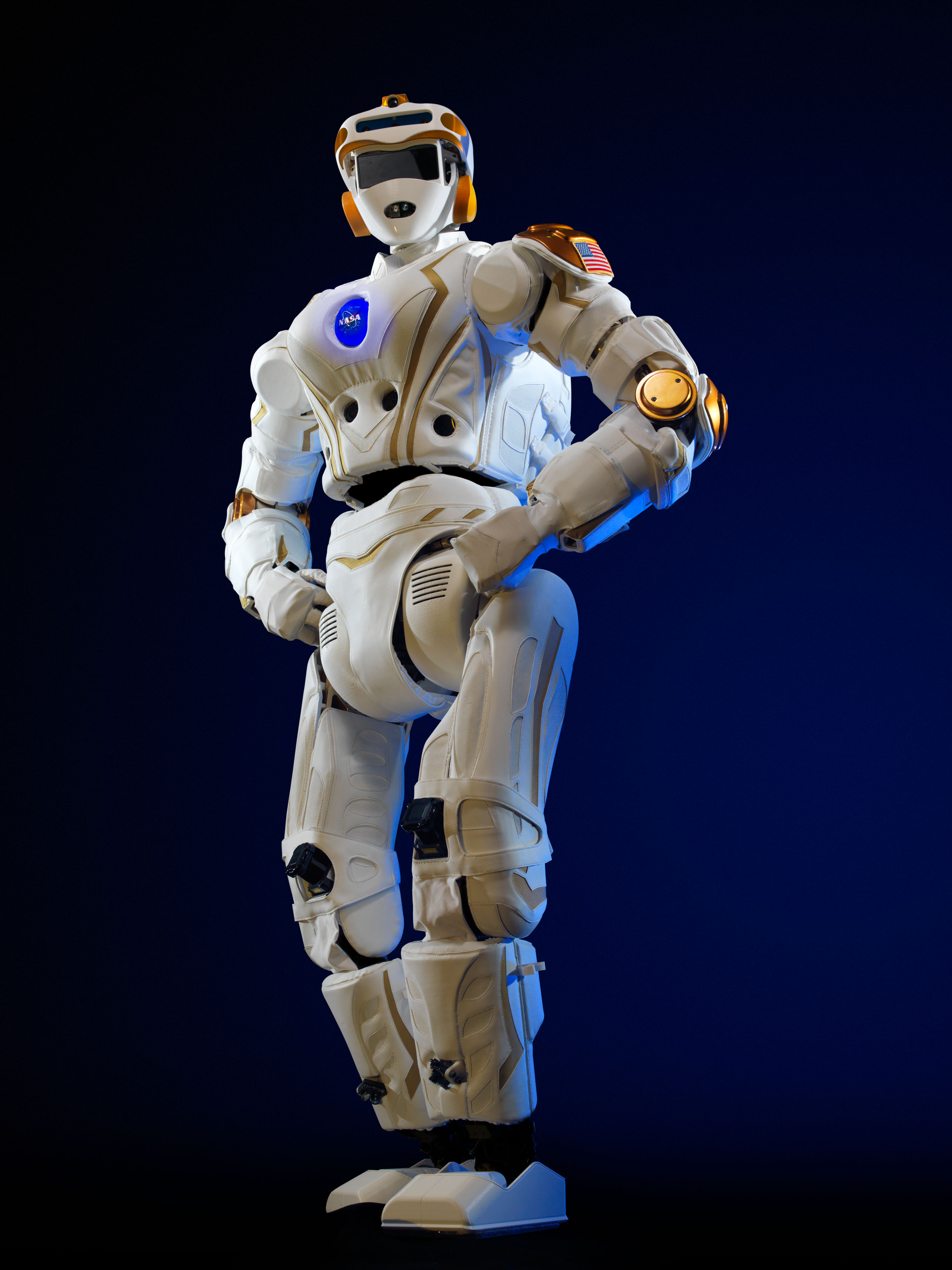 Picture of white NASA android robot standing with hands on hips